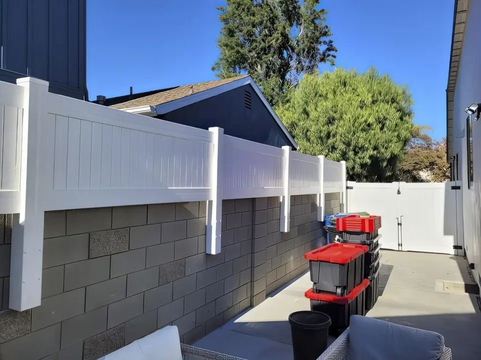 Vinyl privacy wall topper on block wall